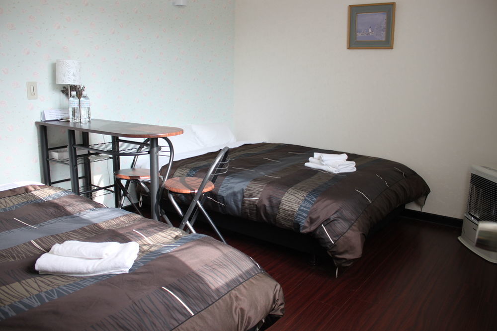 Petit Hotel Melon Furano Bagian luar foto