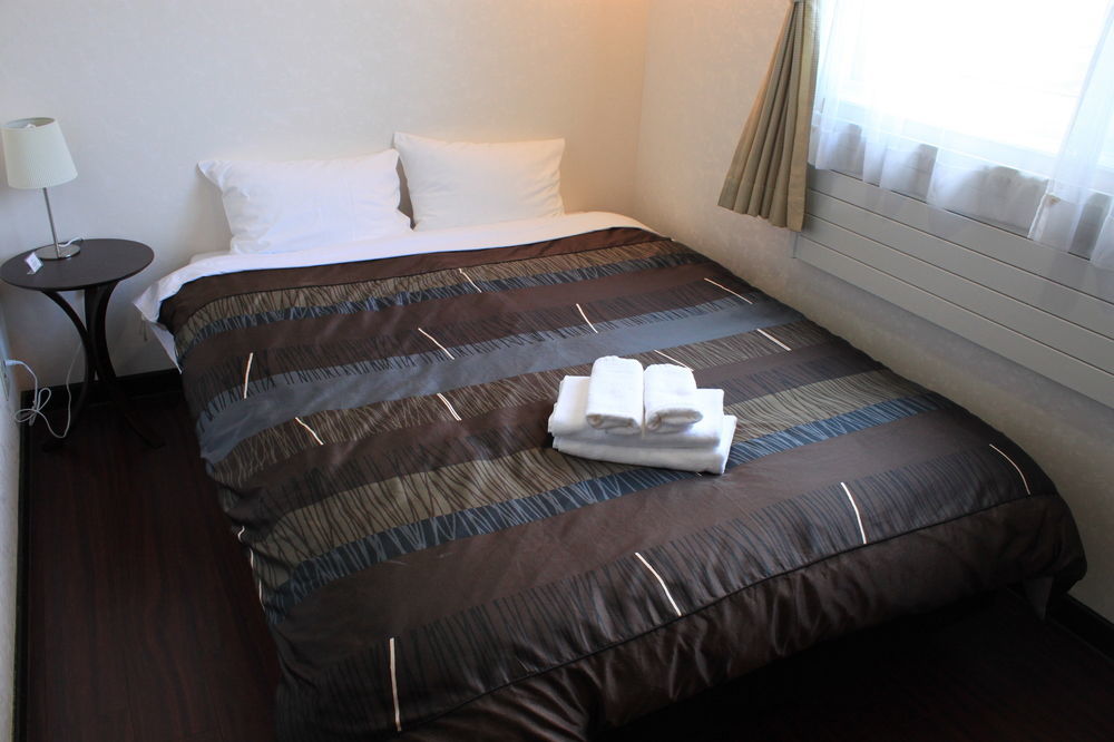 Petit Hotel Melon Furano Bagian luar foto