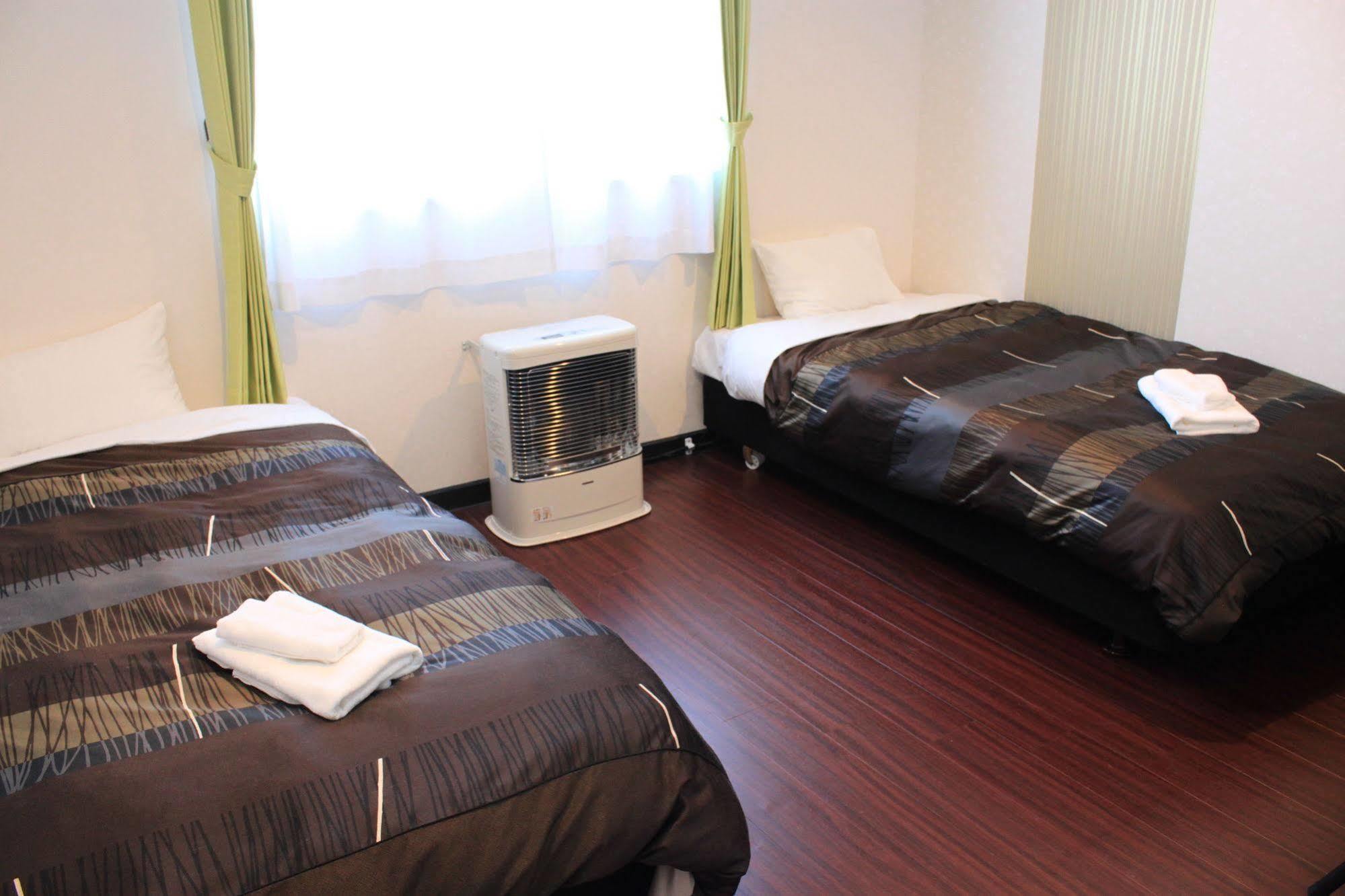 Petit Hotel Melon Furano Bagian luar foto